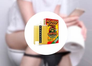 Monkey Flask product with a woman peeing as background
