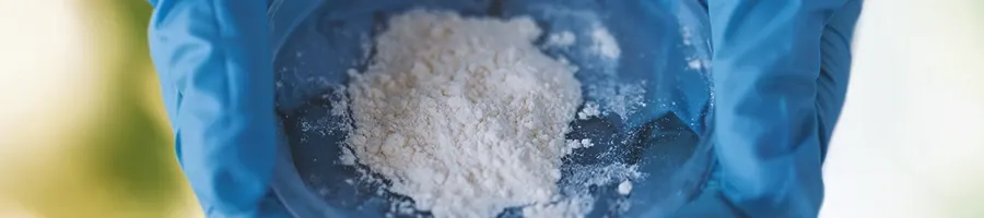 Close up shot of meth held by a chemist